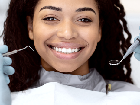 Dentist Holding Dental Tools